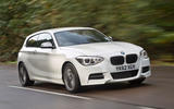 BMW M135i 2012 front quarter tracking hero