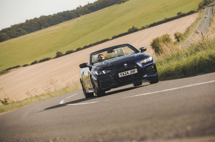 BMW M440i Cabriolet in blue   cornering front